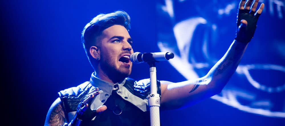 Adam Lambert singing in live performance.