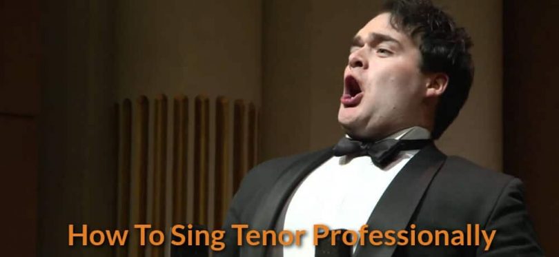Tenor is singing classical song on stage.