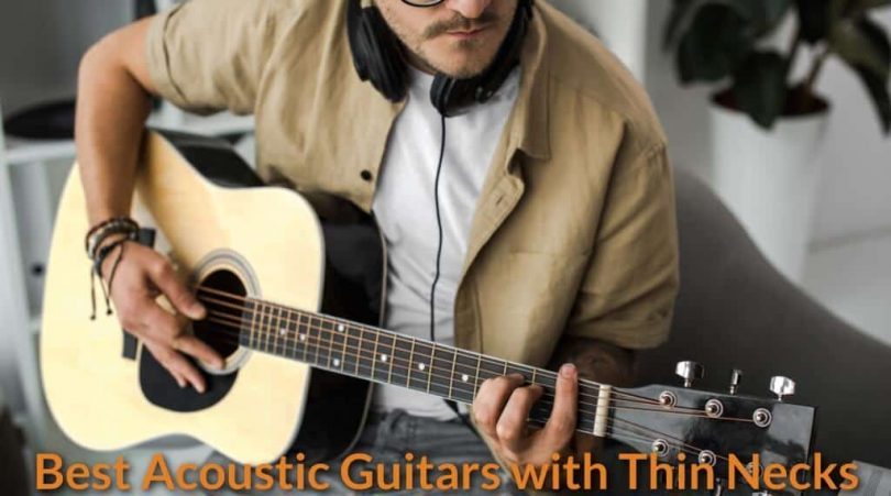 A guitarist practice with a thinner neck acoustic guitar.
