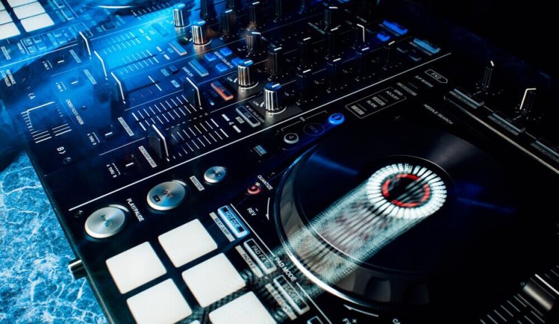 The DJ controller's platter is spinning automatically.